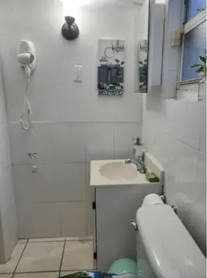 a white bathroom with a sink and a shower at Coco Sol 2 by MyMiamiStay in Miami