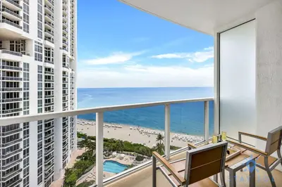 a balcony with a view of the ocean at Deluxe Studio Ocean View Premium Amenities in Sunny Isles Beach