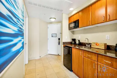 a kitchen with a sink and a counter top at Deluxe Studio Ocean View Premium Amenities in Sunny Isles Beach