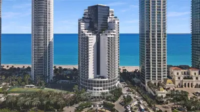 an aerial view of two tall buildings next to the ocean at Deluxe Studio Ocean View Premium Amenities in Sunny Isles Beach