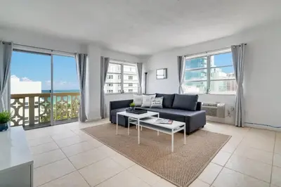 a living room with a couch and a table at 1101- Luxurious 1BR & 2 Bath with City & Ocean Views in Miami Beach