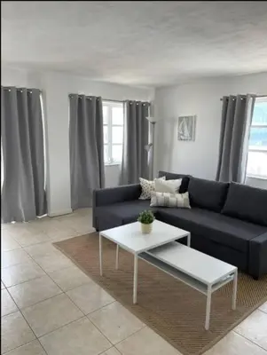 a living room with a couch and a table at 1401- Stylish 1BR& 2BA with Breathtaking Ocean Views in Miami Beach
