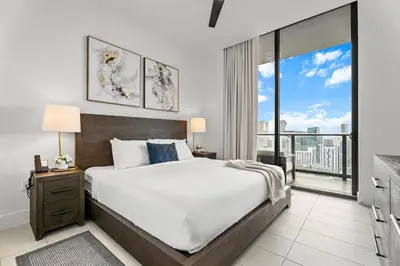 a bedroom with a large bed and a large window at 5108Great Penthouse, Bay view, in the heart of MIAMI in Miami