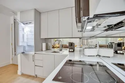 a kitchen with white cabinets and a sink at Vonder Miami Beach - Unit 1 in Miami Beach