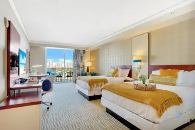 a hotel room with two beds and a balcony at Luxury Bayfront Studio with Balcony Amazing Pool in Sunny Isles Beach