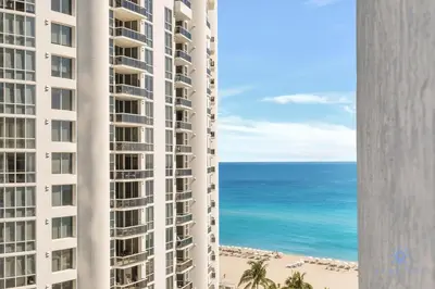 a view of the ocean from the balcony of a building at Luxury Bayfront Studio with Balcony Amazing Pool in Sunny Isles Beach