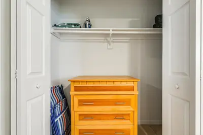 a closet with a wooden dresser and a drawer at 2 Mi to Dtwn Hollywood Vibrant Pet-Friendly Condo in Hallandale Beach