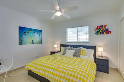 a bedroom with a bed and a ceiling fan at 2 Mi to Ocean Dog-Friendly Hallandale Beach Condo in Hallandale Beach