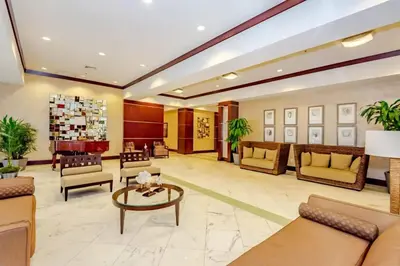 a lobby of a hospital with couches and a table at Beach Vibes & 30th Floor Ocean Views in Sunny Isles Beach