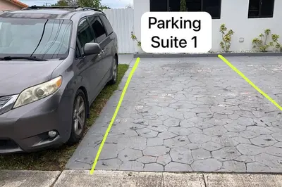 a gray van parked in a parking lot at Private Double Room Near Miami Clinics in Miami