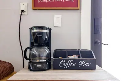 a coffee maker sitting on a counter next to a box at Private Double Room Near Miami Clinics in Miami