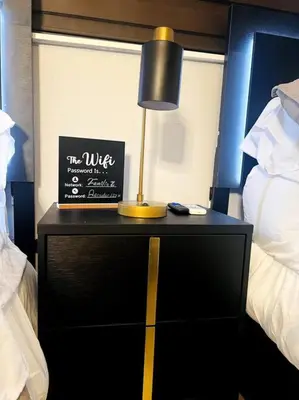 a nightstand with a lamp on it in a bedroom at Private Double Room Near Miami Clinics in Miami