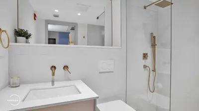 a white bathroom with a sink and a shower at Vonder Miami Beach - Unit 3 in Miami Beach