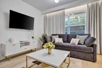 a living room with a couch and a tv at Vonder Miami Beach - Unit 4 in Miami Beach