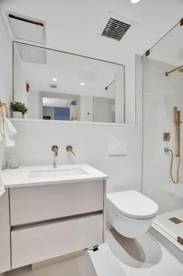 a white bathroom with a sink and a toilet at Vonder Miami Beach - Unit 4 in Miami Beach