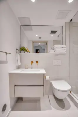 a white bathroom with a sink and a toilet at Vonder Miami Beach - Unit 5 in Miami Beach