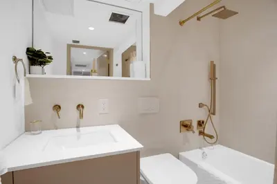 a white bathroom with a sink and a mirror at Vonder Miami Beach - Unit 6 in Miami Beach