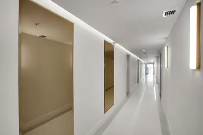 a hallway of a building with white walls and white floors at Vonder Miami Beach - Unit 8 in Miami Beach