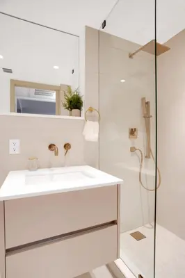 a white bathroom with a sink and a shower at Vonder Miami Beach - Unit 9 in Miami Beach