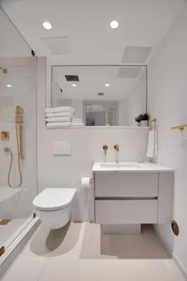 a white bathroom with a toilet and a sink at Vonder Miami Beach - Unit 10 in Miami Beach