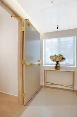 a room with a window and a vase of flowers on a table at Vonder Miami Beach - Unit 12 in Miami Beach