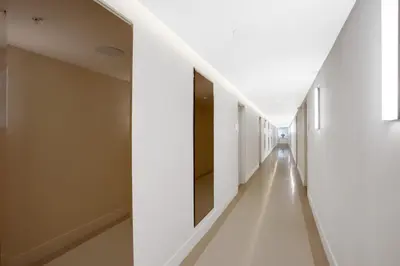 a hallway of a hospital with white walls and white floors at Vonder Miami Beach - Unit 13 in Miami Beach