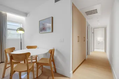 a white dining room with a white table and chairs at Vonder Miami Beach - Unit 16 in Miami Beach