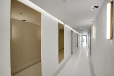 a hallway of a house with white walls and white floors at Vonder Miami Beach - Unit 20 in Miami Beach