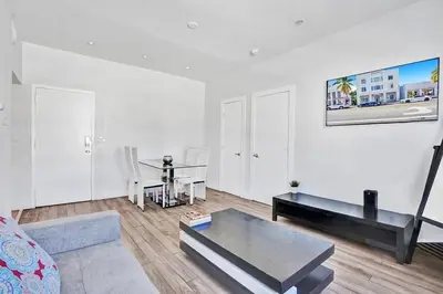 a living room with a couch and a table at Miami Beach Home, 7 guests, Steps from the beach in Miami Beach