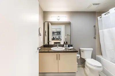 a bathroom with a sink and a toilet at Renovated Coconut Grove Studio includes Parking in Miami