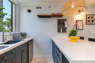 a kitchen with a sink and a counter top at The Palms Coconut Grove 1 bedroom condo includes parking in Miami
