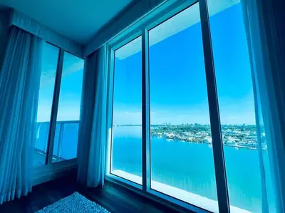 a room with windows with a view of the water at North Bay Village - perfect view in Miami Beach