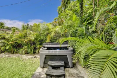 a tv sitting in the grass in a garden at Luxury Miami Retreat in North Miami