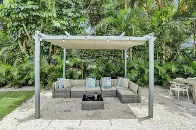 a gazebo with a couch and a table at Luxury Miami Retreat in North Miami