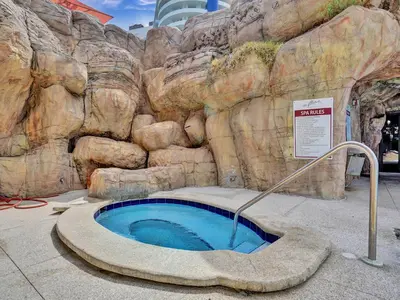 a large bath tub in a fake rock wall at Stunning Ocean View Beach Retreat 1205 in Miami Beach