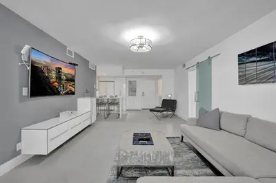 a living room with a couch and a table at Ocean View Elegant 2BDR 2BA Condo Beach Access 714 in Miami Beach