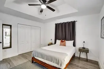 a bedroom with a bed with a ceiling fan at Beautiful Home in Maimi in Miami