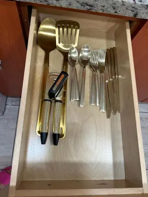 a drawer with utensils in a wooden box at Beautiful apartment with very elegant colonial decoration in Tamiami