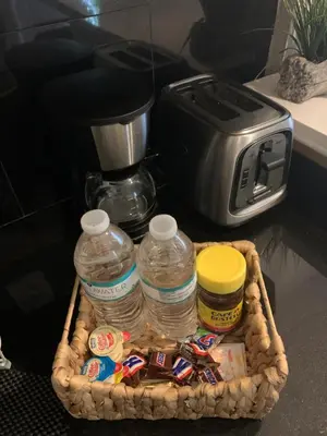 a basket filled with water bottles and a toaster at La Casita in Miami