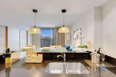 a kitchen with a sink and a counter top at Amazing Apartment Oceanview Beautiful Amenities in Sunny Isles Beach