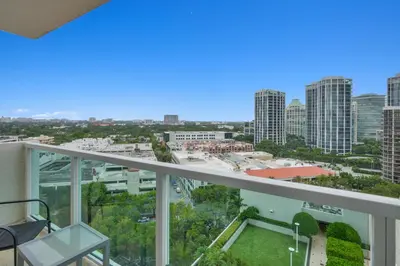 a view of the city from the balcony of a building at Find Tranquility in the Grove in Miami