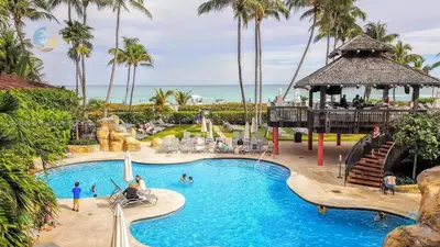 a pool at a resort with people playing in it at Beautiful 2 Br Apartment Amazing Pool in Miami Beach