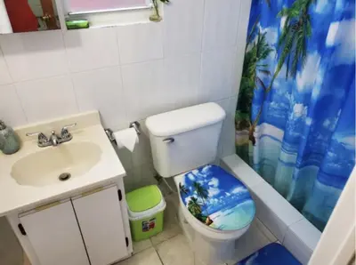 a bathroom with a toilet and a sink and a shower at Coco Sol 1 by MyMiamiStay in Miami
