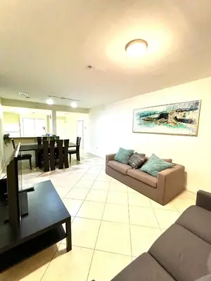 a living room with a couch and a piano at Private bedroom in Miami - Coral Gables 601 in Miami