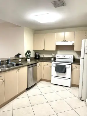 a kitchen with a white stove and a sink at Private bedroom in Miami - Coral Gables 601 in Miami