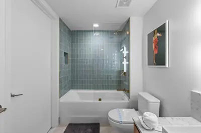 a bathroom with a tub and a toilet and a sink at New Luxury Apartment at Downtown Miami in Miami