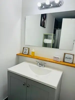 a bathroom with a sink and a mirror at Studio with Terrace Near Hard Rock-Patio in Fleetwood Manor