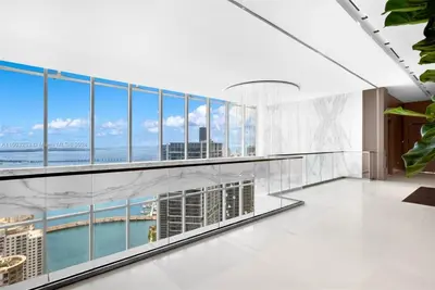 a view from the balcony of a building with glass windows at ASTON MARTIN TOWER Miami in Miami