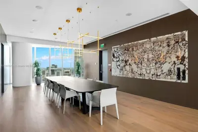 a dining room with a table and chairs at ASTON MARTIN TOWER Miami in Miami