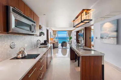 a kitchen with a sink and a counter top at 2 Bedroom Private Residence at Carillon Miami Resort -522 in Miami Beach